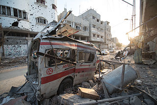 Photo taken during the 72hr ceasefire between Hamas and Israel on 6th of August 2014. Destroyed ambulance in the CIty of Shijaiyah in the Gaza Strip. Photo by Boris Niehaus (www.1just.de), licensed under CC-BY-SA-4.0, source: Wikimedia Commons http://commons.wikimedia.org/wiki/File:Destroyed_ambulance_in_the_CIty_of_Shijaiyah_in_the_Gaza_Strip.jpg